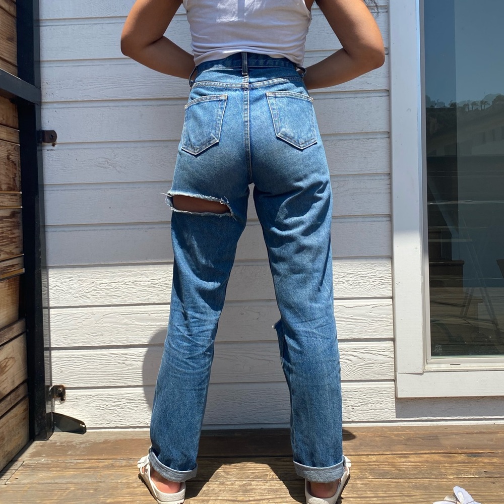Vintage jeans with well placed rips.
